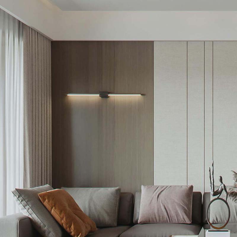 Slim, horizontal fixture mounted on a neutral wall, providing subtle accent lighting for framed art or photos.